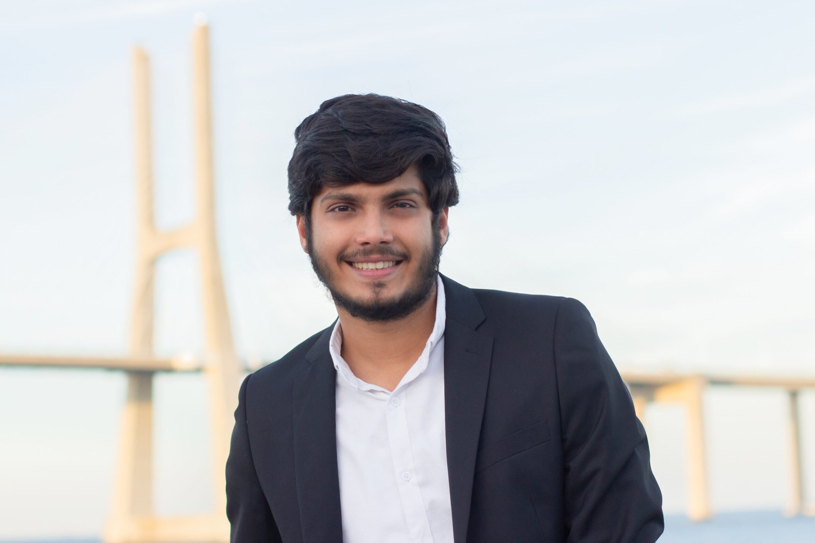 Portrait of good-looking smiling Arabic man in suit
